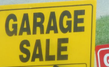 Garage sale sign in yard